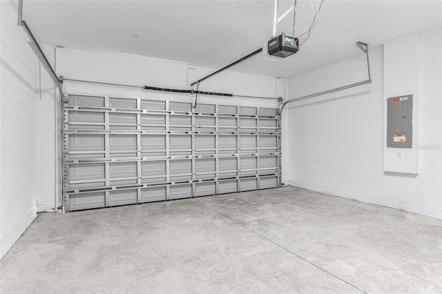 garage featuring a garage door opener and electric panel