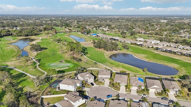 bird's eye view with a residential view, a water view, and view of golf course