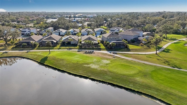 drone / aerial view featuring a residential view and a water view