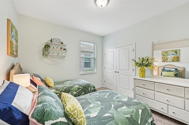 bedroom featuring a closet and carpet