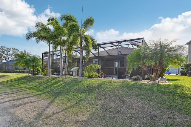 view of yard featuring glass enclosure