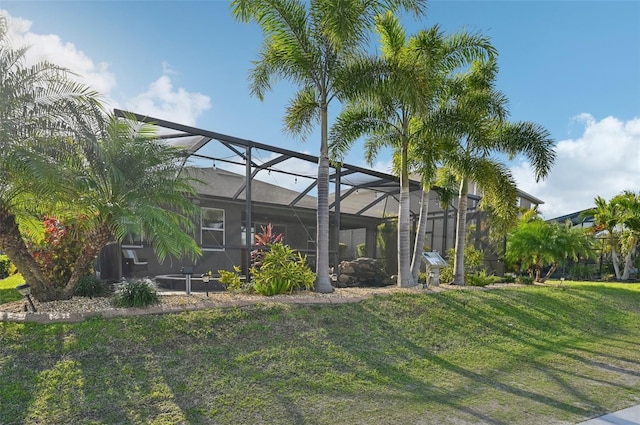 view of yard featuring glass enclosure