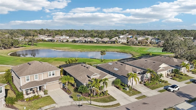 bird's eye view with a residential view, golf course view, and a water view