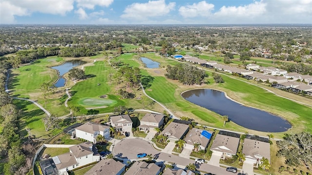 aerial view featuring view of golf course, a water view, and a residential view