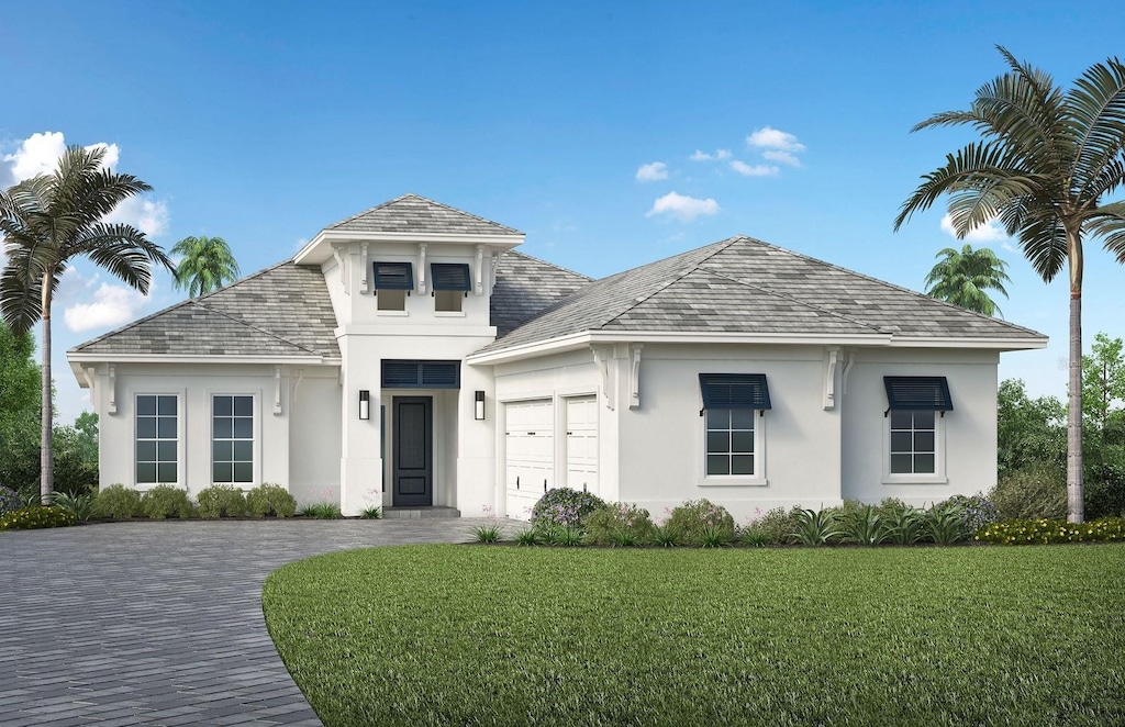 view of front of home with a garage and a front yard