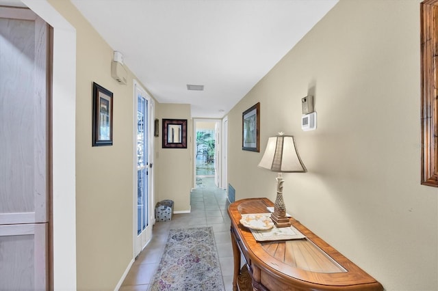 hall with light tile patterned flooring