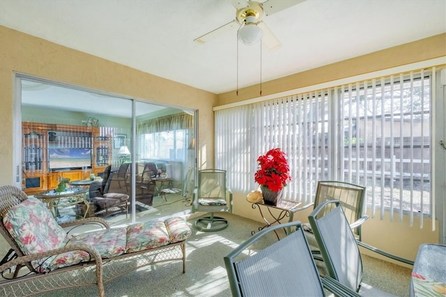 sunroom / solarium featuring ceiling fan