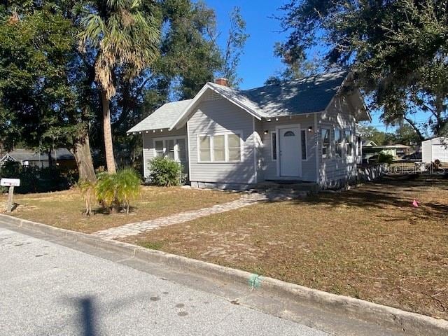 bungalow with a front yard