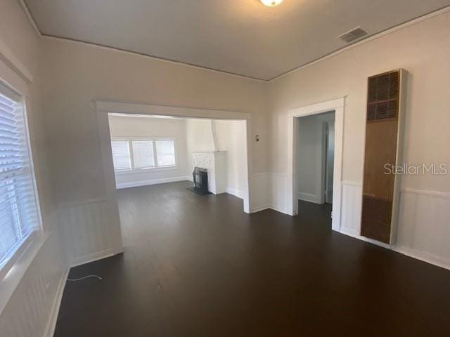 spare room with dark hardwood / wood-style flooring