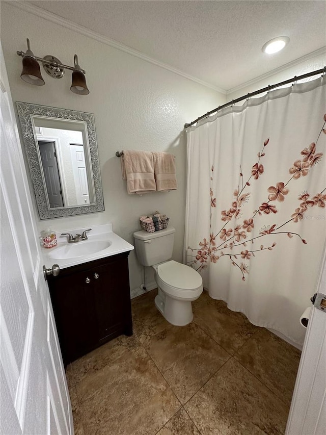 bathroom featuring crown molding, vanity, toilet, and a textured ceiling