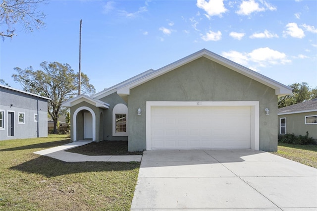 ranch-style house featuring a garage and a front yard