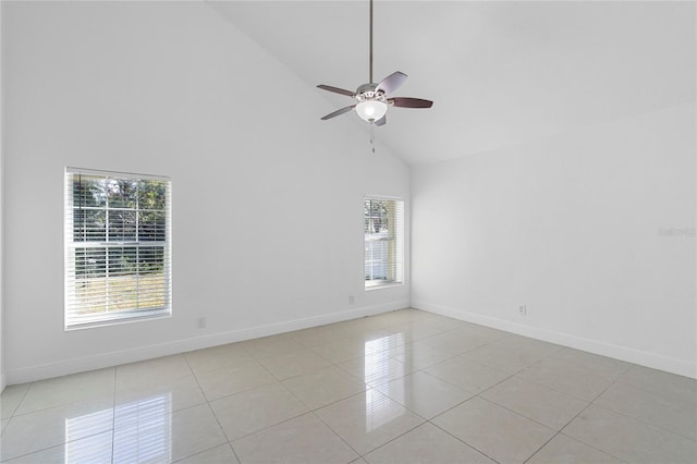 tiled spare room featuring ceiling fan and high vaulted ceiling