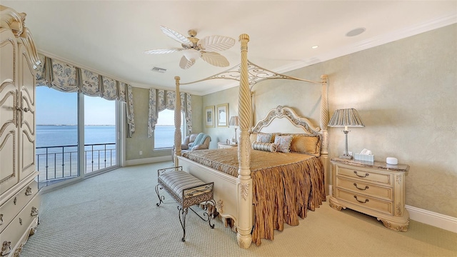 carpeted bedroom featuring a water view, ceiling fan, ornamental molding, and access to exterior