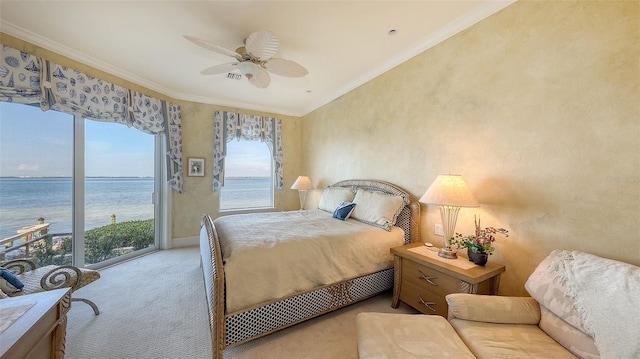 carpeted bedroom with a water view, ceiling fan, ornamental molding, and access to outside