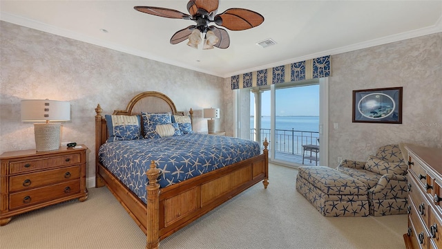 carpeted bedroom featuring a water view, ceiling fan, crown molding, and access to outside