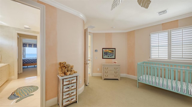 bedroom with crown molding and light carpet