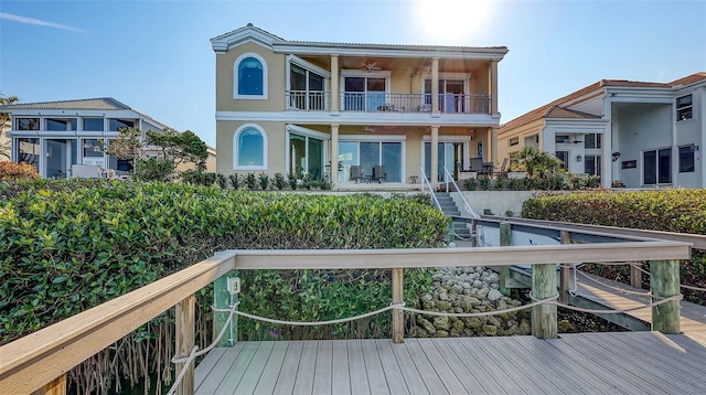 rear view of property with a balcony