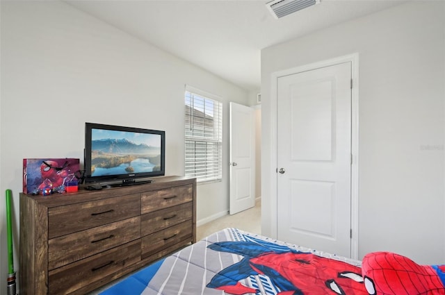 bedroom with light colored carpet