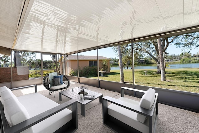 sunroom / solarium with a water view