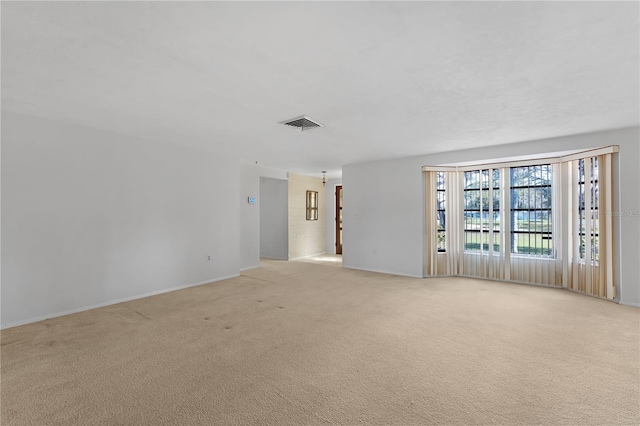 empty room featuring light colored carpet