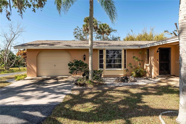 ranch-style home with a garage