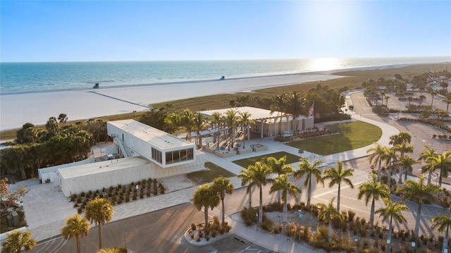 birds eye view of property with a view of the beach and a water view