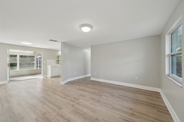 unfurnished living room with light wood-type flooring