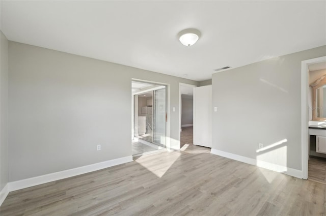 empty room featuring light hardwood / wood-style floors