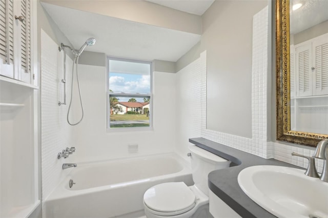 full bathroom with bathtub / shower combination, vanity, toilet, and tasteful backsplash