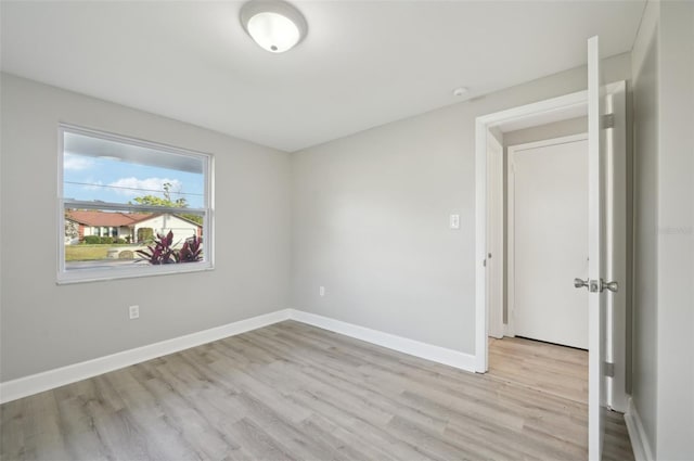 unfurnished room featuring light hardwood / wood-style flooring