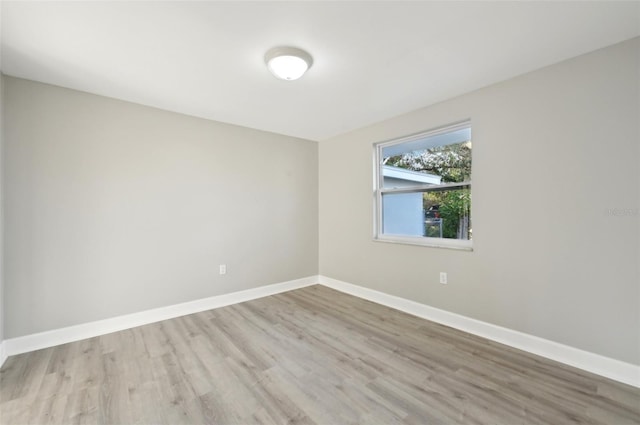 spare room with light hardwood / wood-style flooring