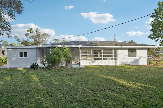 back of house featuring a yard