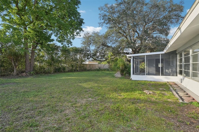 view of yard with a sunroom