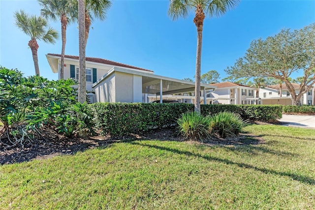 view of property exterior featuring a lawn