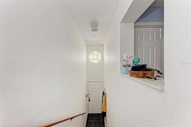 interior space featuring a textured ceiling