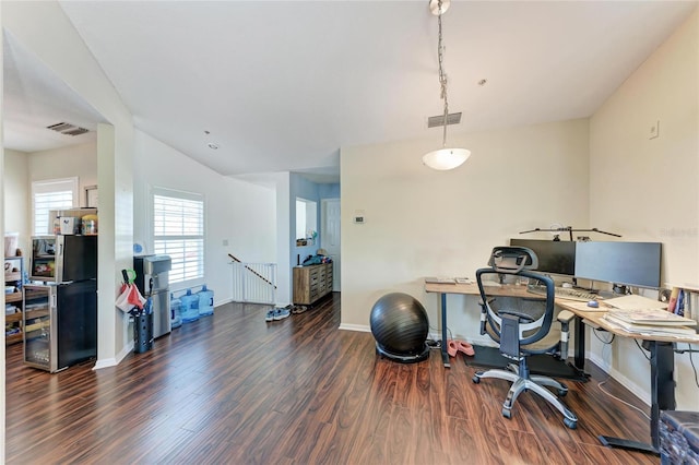 office space with dark wood-type flooring and lofted ceiling