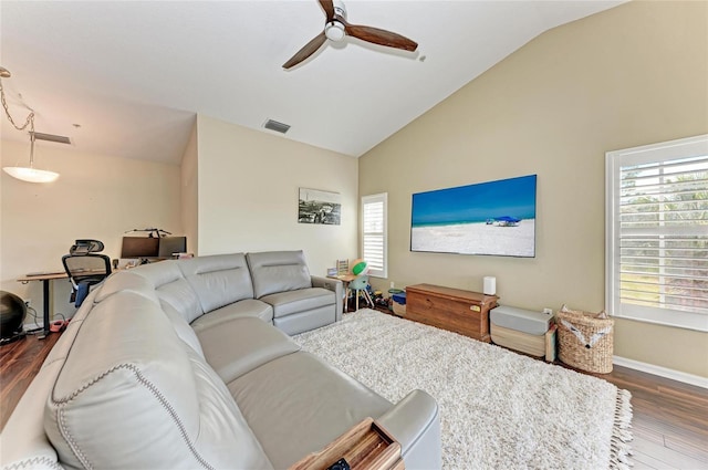 living room with lofted ceiling, hardwood / wood-style floors, and ceiling fan