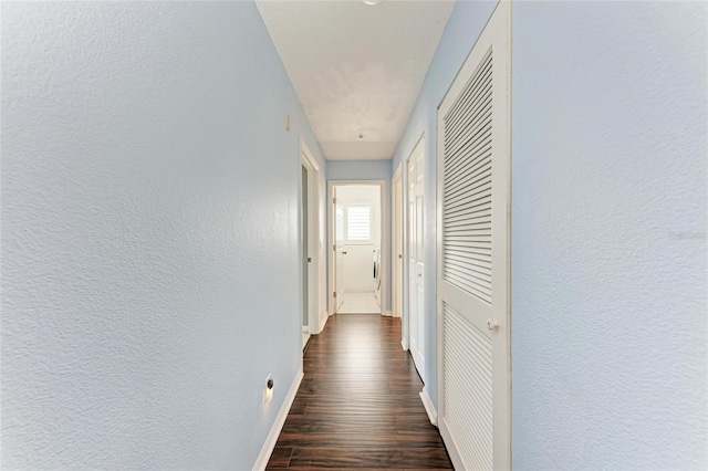 corridor featuring dark hardwood / wood-style flooring