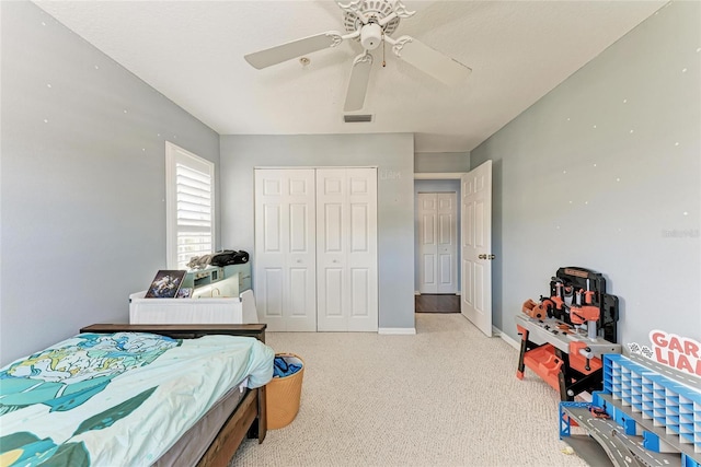 bedroom featuring carpet, ceiling fan, and a closet