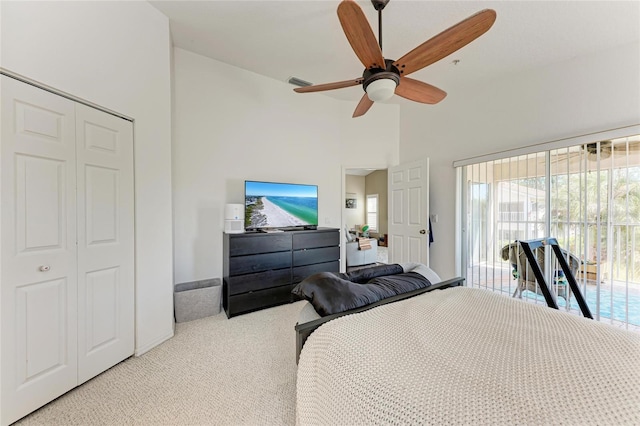 bedroom featuring high vaulted ceiling, light colored carpet, access to exterior, ceiling fan, and a closet