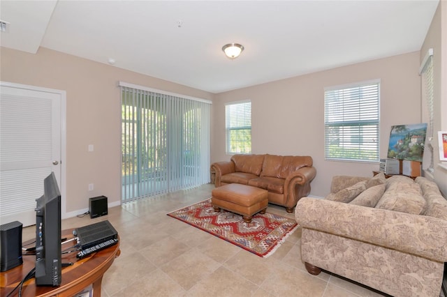 tiled living room featuring a wealth of natural light