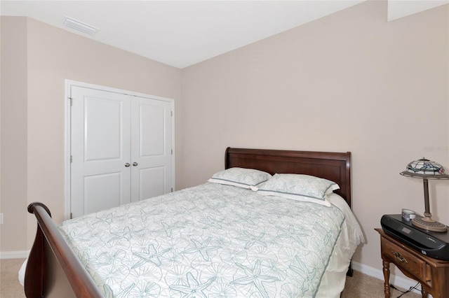 carpeted bedroom featuring a closet