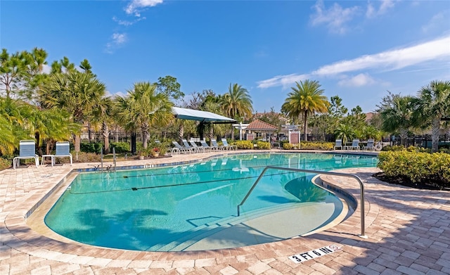 view of swimming pool featuring a gazebo and a patio area