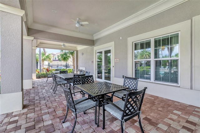 sunroom / solarium with french doors and ceiling fan