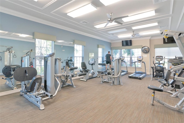 workout area with crown molding, light carpet, and ceiling fan