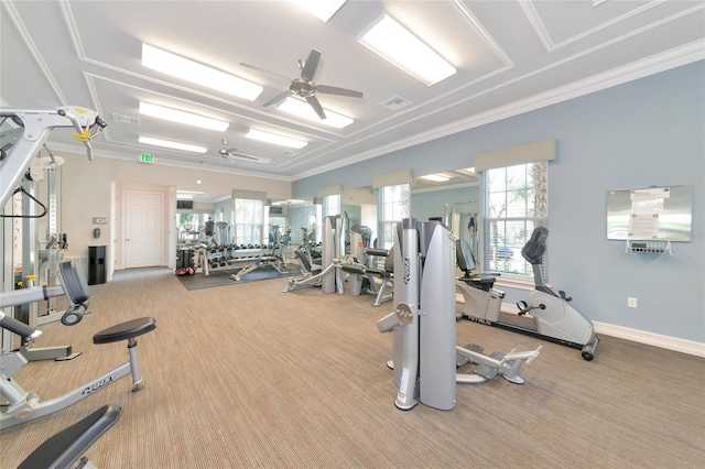 gym with crown molding, light colored carpet, and ceiling fan