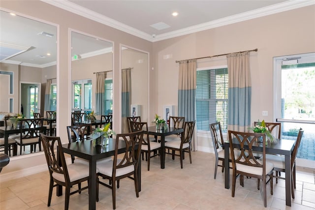 dining room featuring crown molding