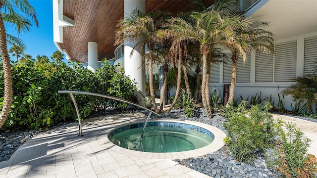 view of pool featuring an in ground hot tub