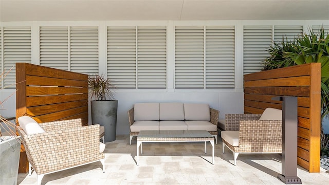 exterior space featuring an outdoor living space and a patio area