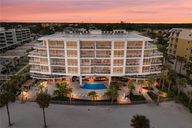 view of outdoor building at dusk